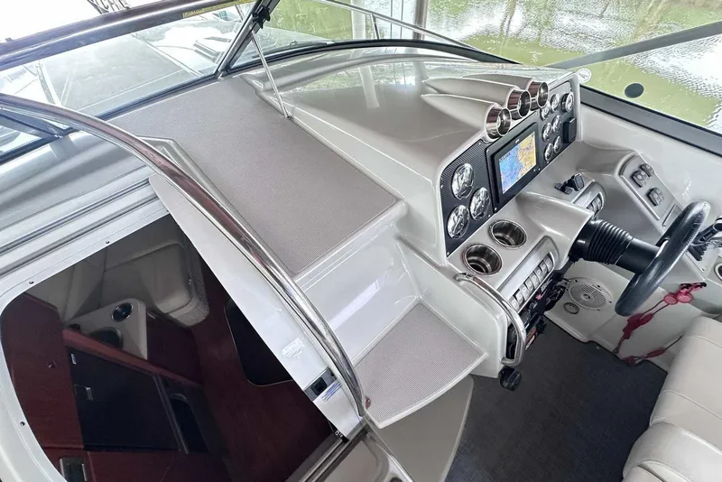 Slide: The Image of 2007 Formula 310 Sun Sport boat interior with helm, navigation system, and cabin entrance. - 35