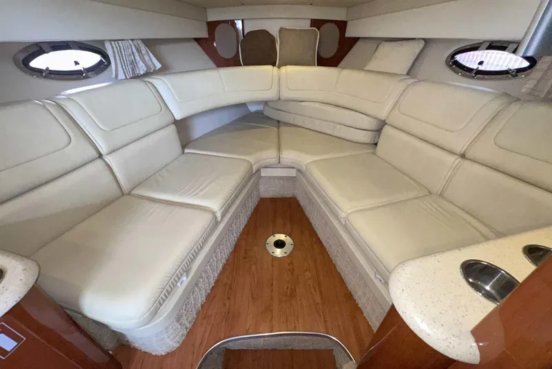 Slide: The Image of 2007 Formula 310 Sun Sport interior with cream leather seating and wood flooring. - 38