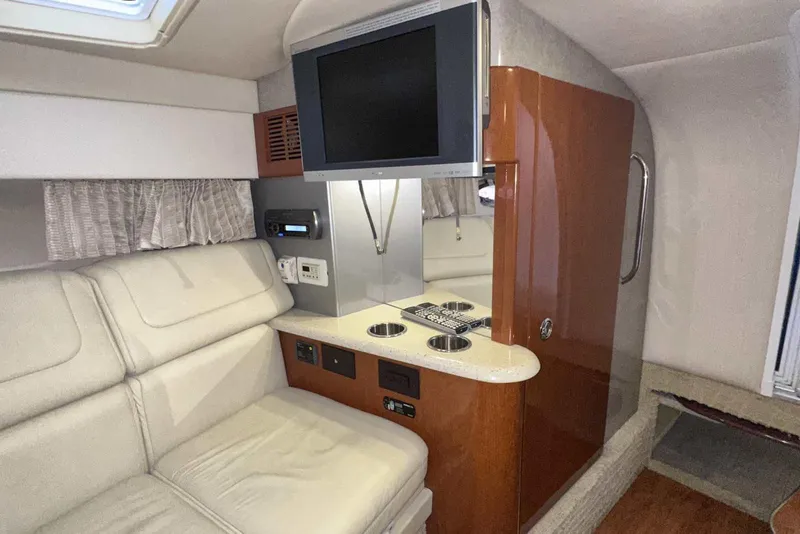 Slide: The Image of 2007 Formula 310 Sun Sport cabin interior with TV, seating, and storage. - 39