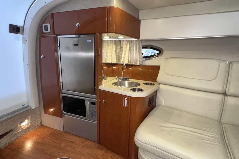 Slide: The Image of 2007 Formula 310 Sun Sport cabin interior with kitchenette and seating area. - 42