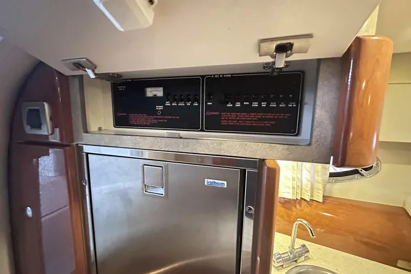 Slide: The Image of 2007 Formula 310 Sun Sport interior with control panel and compact fridge. - 43