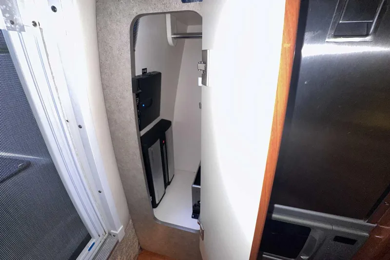 Slide: The Image of 2007 Formula 310 Sun Sport interior storage compartment with modern design and sleek finishes. - 44