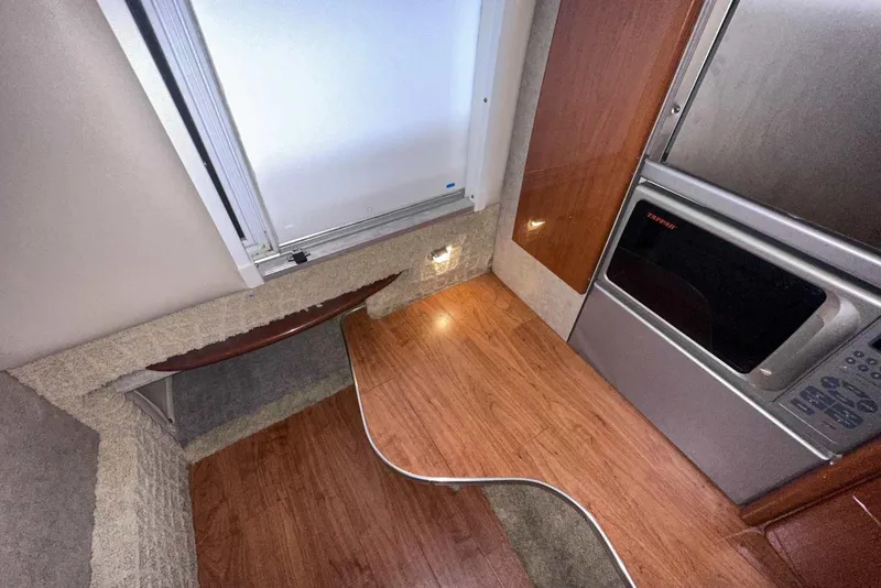 Slide: The Image of 2007 Formula 310 Sun Sport interior with wood flooring and modern appliances. - 47