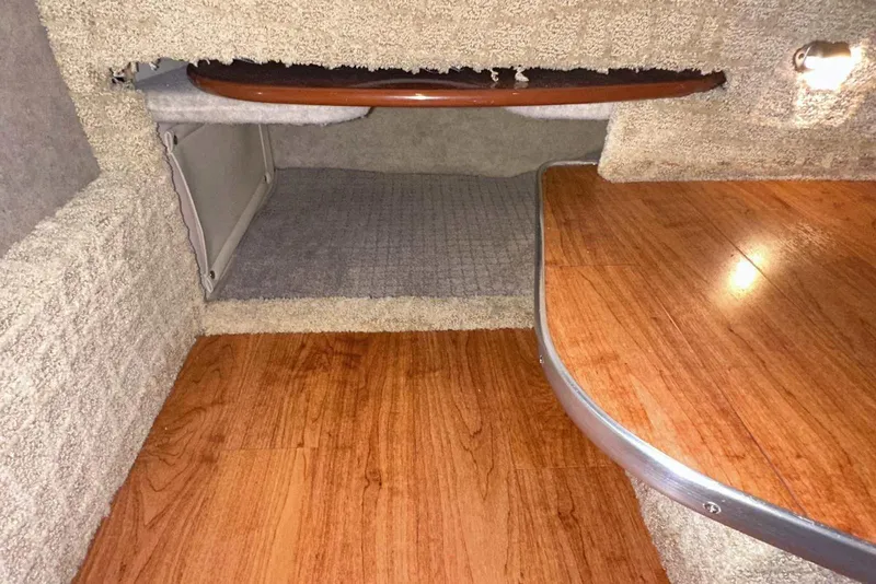 Slide: The Image of 2007 Formula 310 Sun Sport cabin interior with wood flooring and carpeted surfaces. - 48