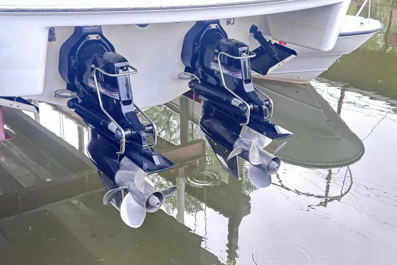 Slide: The Image of 2007 Formula 310 Sun Sport boat with dual Mercury outboard motors in water. - 6