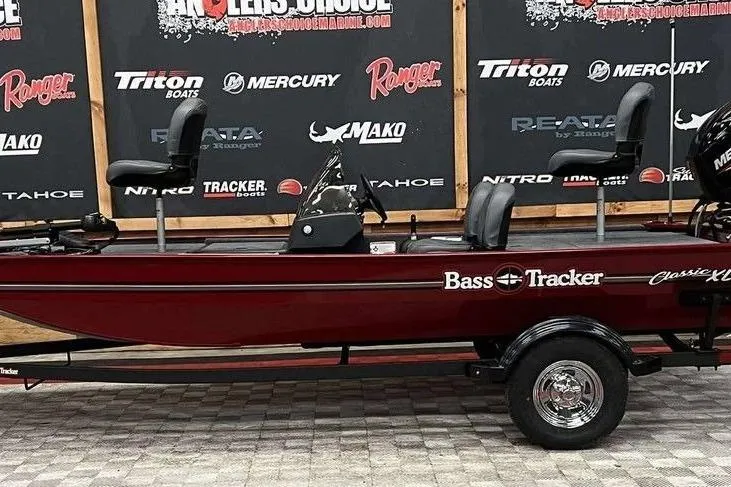 The Image of 2026 Tracker BASS TRACKER® Classic XL boat on display, maroon color, side view. - 1