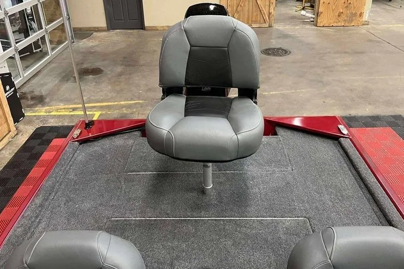 Slide: The Image of 2026 Tracker BASS TRACKER® Classic XL boat interior with gray seating and red accents. - 3