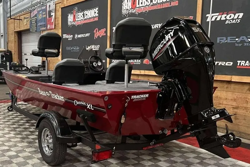 Slide: The Image of 2026 Tracker BASS TRACKER® Classic XL boat with Mercury engine in showroom. - 5