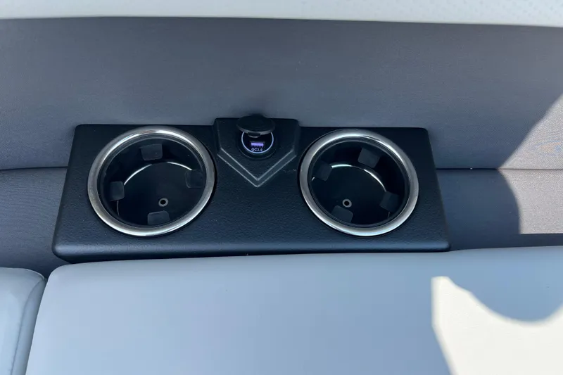 Slide: The Image of Cup holders and USB port on 2025 Harris Cruiser 230 boat interior. - 13