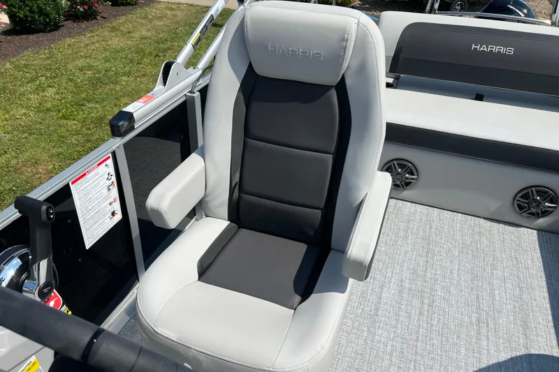 Slide: The Image of Captain's chair on 2025 Harris Cruiser 230 boat, featuring sleek design and comfortable seating. - 16