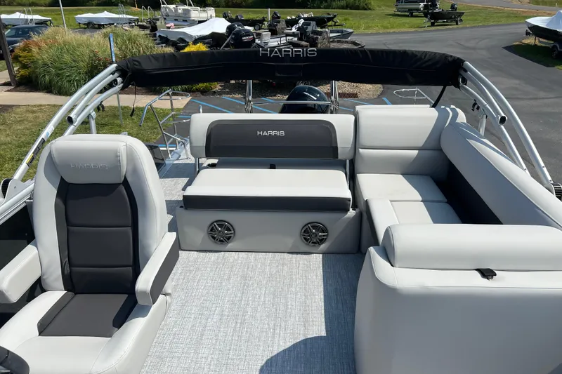 Slide: The Image of 2025 Harris Cruiser 230 boat interior with plush seating and modern design. - 17
