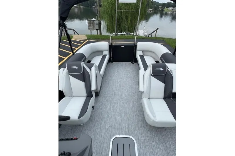 Slide: The Image of 2026 Bennington 22 SSR pontoon boat interior with stylish seating and lake view. - 4