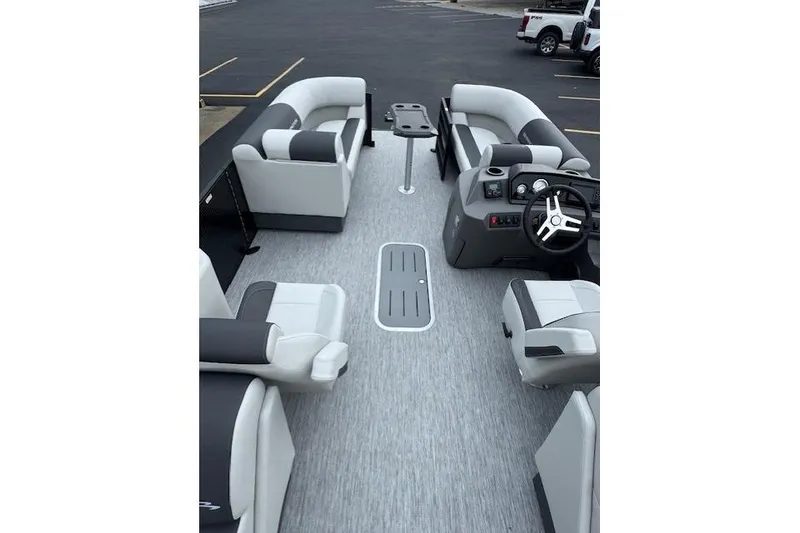 Slide: The Image of 2026 Bennington 22 SSR pontoon boat interior with modern seating and steering console. - 6