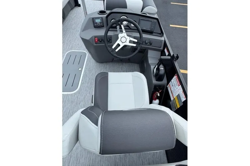 Slide: The Image of 2026 Bennington 22 SSR boat interior with steering wheel and control panel. - 7
