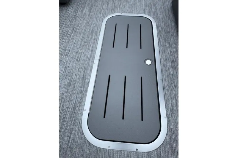 Slide: The Image of 2026 Bennington 22 SSR boat floor hatch with sleek design and textured surface. - 9