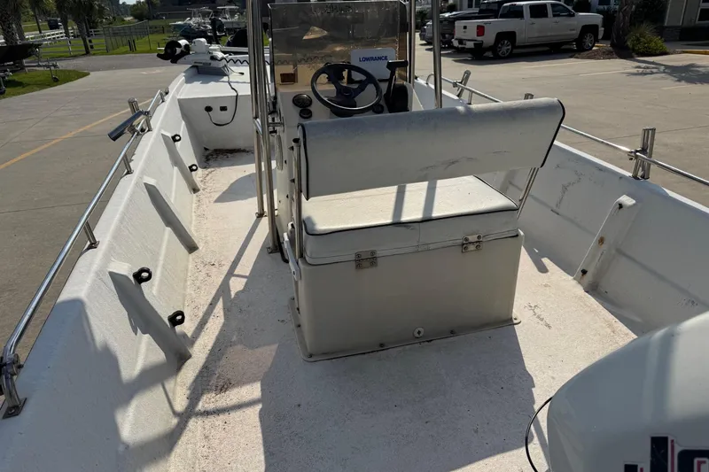 Slide: The Image of 1998 Coastal Skiff 19 boat interior with steering console and seating. - 15