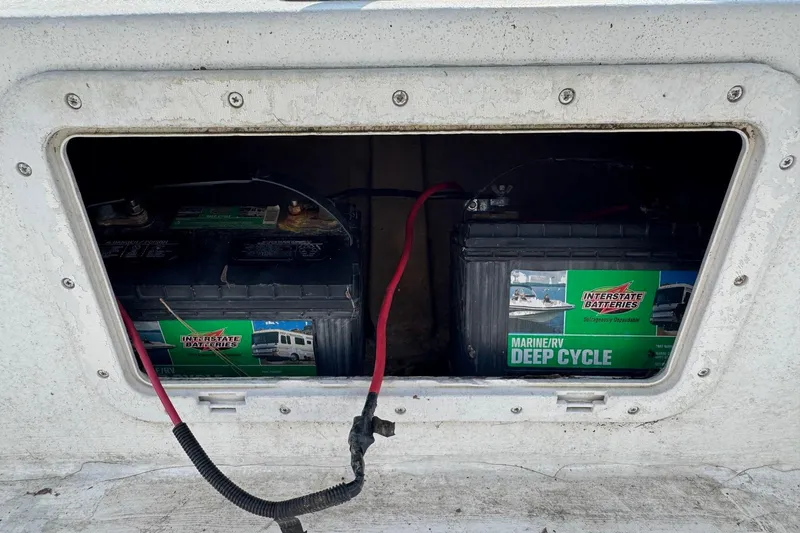 Slide: The Image of Marine deep cycle batteries in a 1998 Coastal Skiff 19 boat compartment. - 17