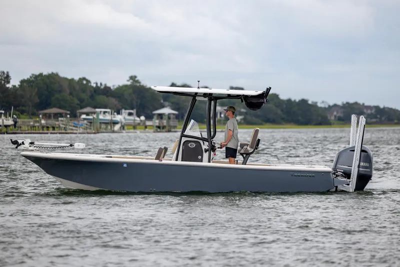 Slide: The Image of 2022 Tidewater 2300 Carolina Bay boat cruising on a calm waterway. - 3