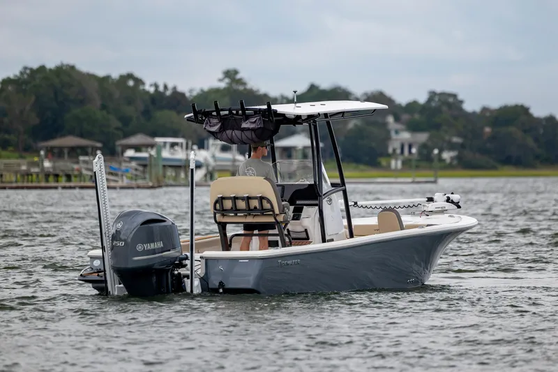 Slide: The Image of 2022 Tidewater 2300 Carolina Bay boat on water with Yamaha engine, scenic background. - 6