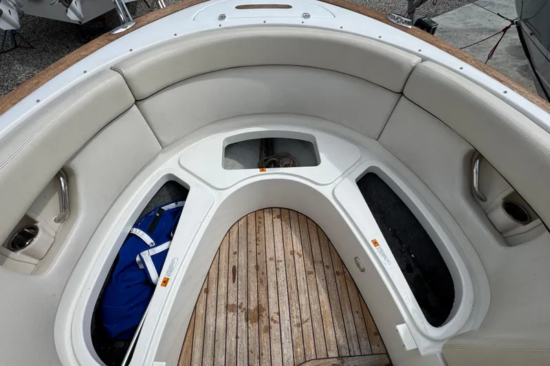 Slide: The Image of 2007 Chris-Craft Launch 28 boat interior with cushioned seating and wooden flooring. - 15