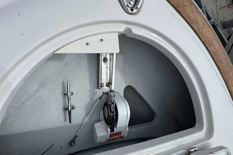 Slide: The Image of 2007 Chris-Craft Launch 28 boat interior detail showing storage compartment and hardware. - 16