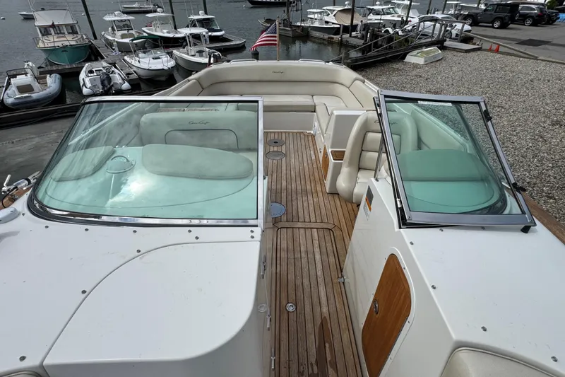 Slide: The Image of 2007 Chris-Craft Launch 28 boat with wooden deck and seating, docked at marina. - 17