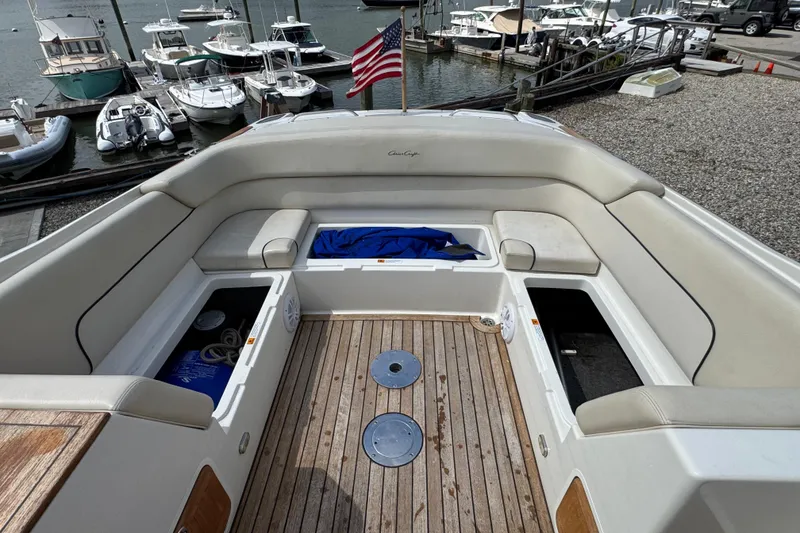 Slide: The Image of 2007 Chris-Craft Launch 28 boat interior with seating and storage, docked at marina. - 19