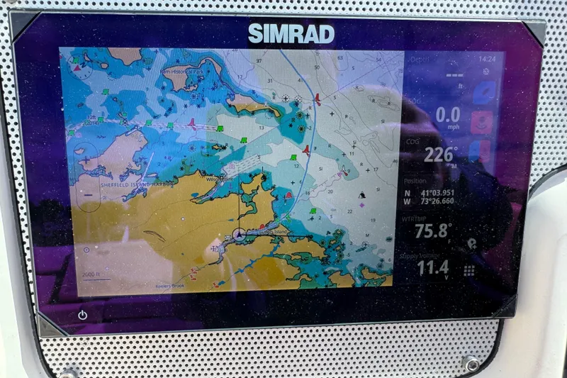 Slide: The Image of Simrad navigation display on 2007 Chris-Craft Launch 28, showing nautical chart and coordinates. - 23