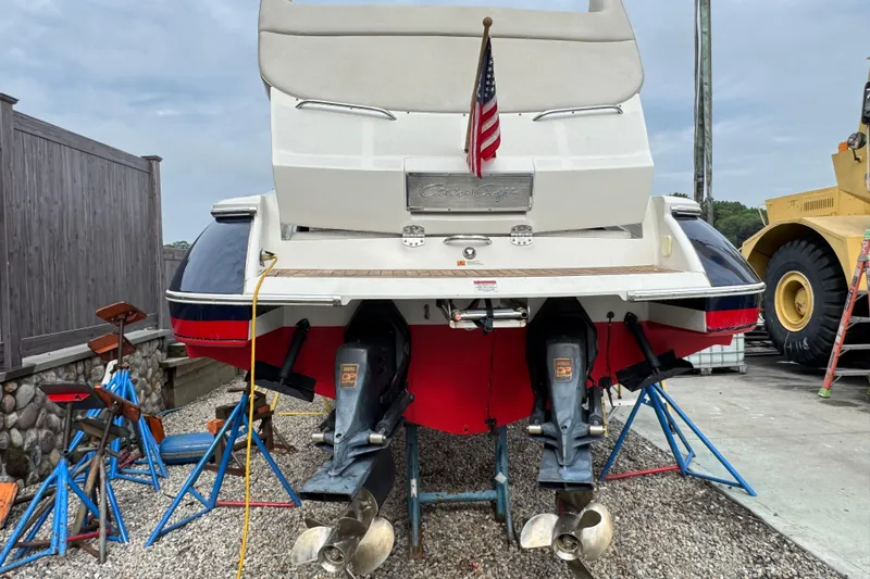 Slide: The Image of 2007 Chris-Craft Launch 28 boat on stands, rear view with American flag. - 5
