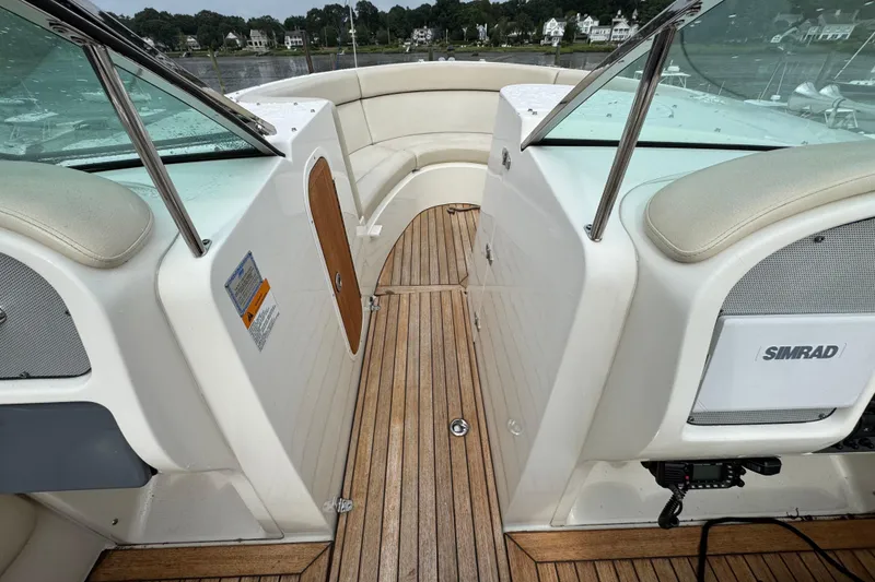 Slide: The Image of 2007 Chris-Craft Launch 28 boat interior with teak flooring and Simrad electronics. - 6