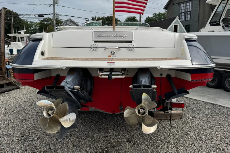 Slide: The Image of 2007 Chris-Craft Launch 28 boat stern view with dual propellers and American flag. - 9