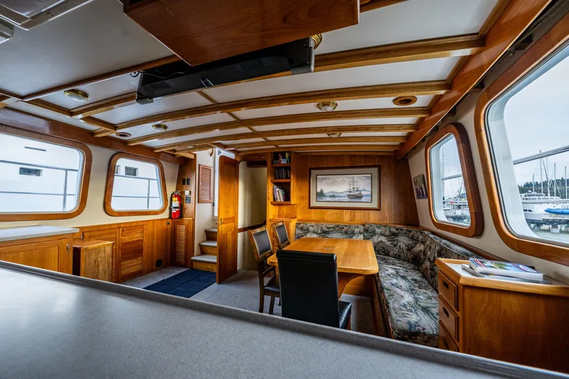 Slide: The Image of Interior of 1978 Hidden Harbor Custom Trawler with wooden furnishings and large windows. - 39