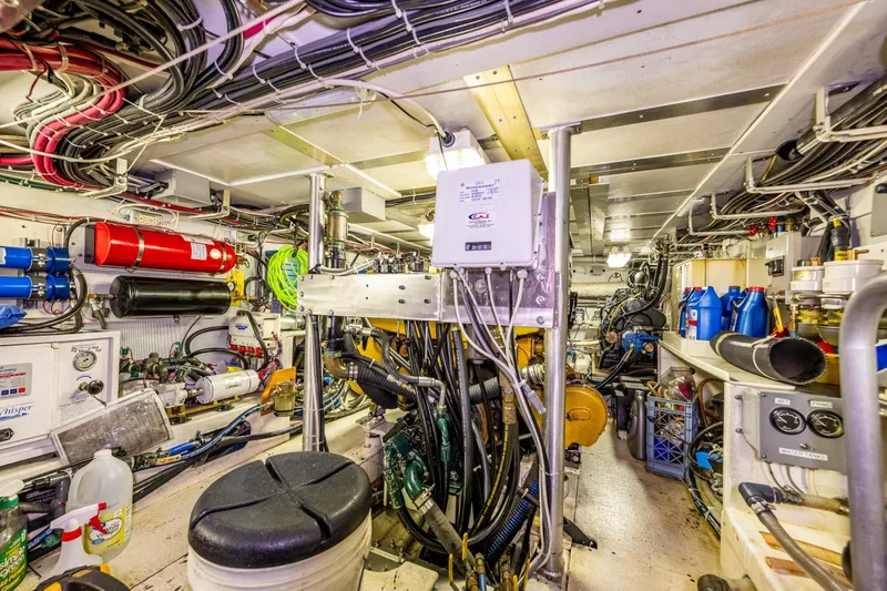 Slide: The Image of Engine room of a 1978 Hidden Harbor Custom Trawler, showcasing complex machinery and equipment. - 41