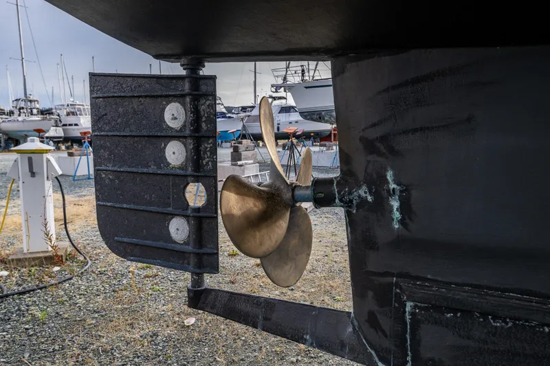 Slide: The Image of Propeller and rudder of 1978 Hidden Harbor Custom Trawler in boatyard. - 58
