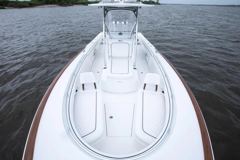 Slide: The Image of 2026 Valhalla Boatworks V-29 Hybrid on water, showcasing sleek design and spacious deck. - 11