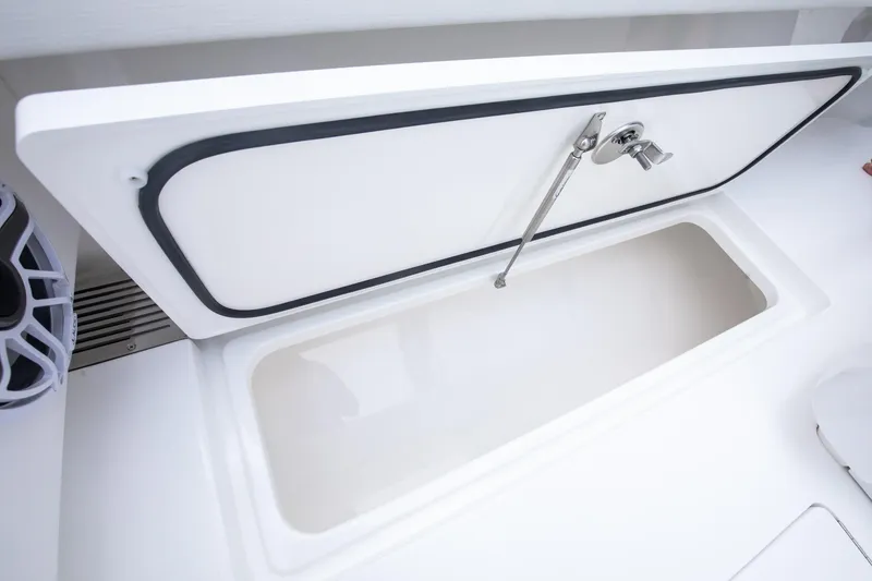 Slide: The Image of Open storage compartment on 2026 Valhalla Boatworks V-29 Hybrid, showcasing sleek design. - 13