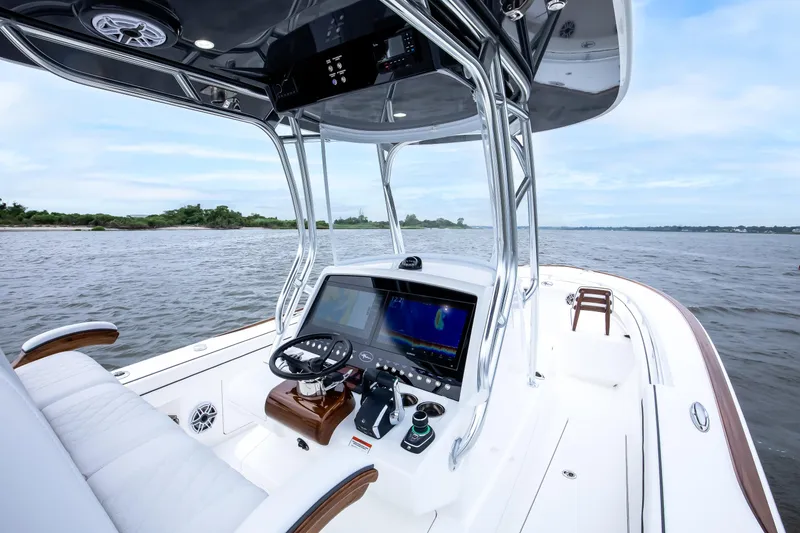 Slide: The Image of 2026 Valhalla Boatworks V-29 Hybrid console with advanced navigation on open water. - 7