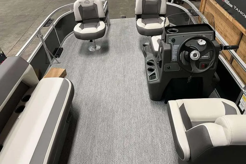 Slide: The Image of 2026 Sun Tracker Bass Buggy® 16 XL Select pontoon boat interior with seating and steering console. - 5