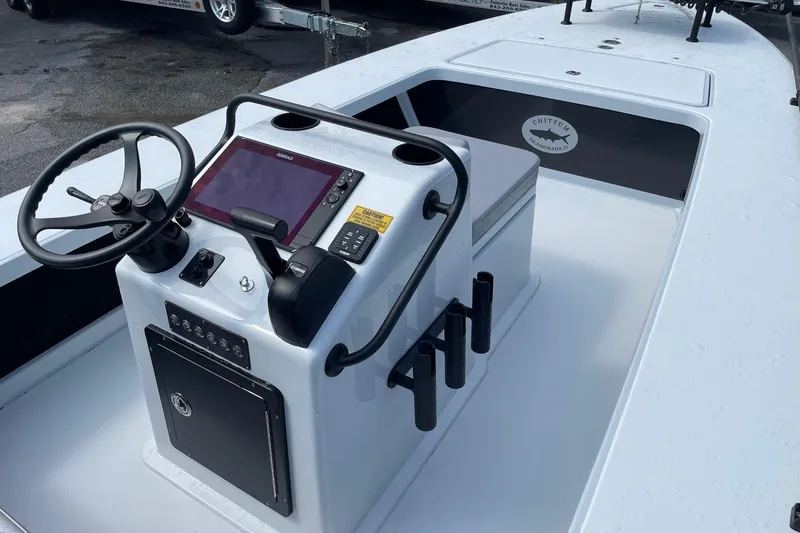 Slide: The Image of 2026 Chittum Skiffs Islamorada 21 boat displayed at Palmetto Boat dealership. - 11