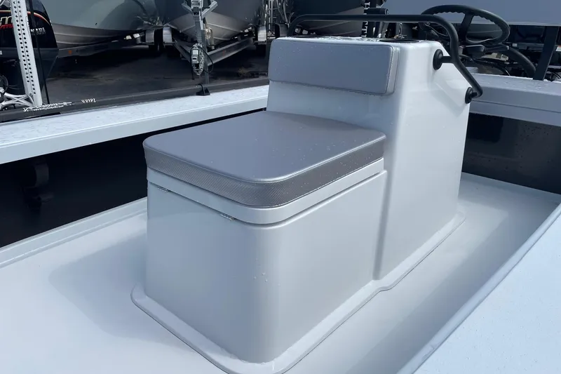 Slide: The Image of 2026 Chittum Skiffs Islamorada 21 boat interior with steering console and navigation equipment. - 14