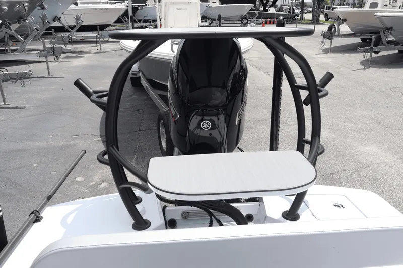 Slide: The Image of 2026 Chittum Skiffs Islamorada 21 with Yamaha engine, docked outdoors. - 23