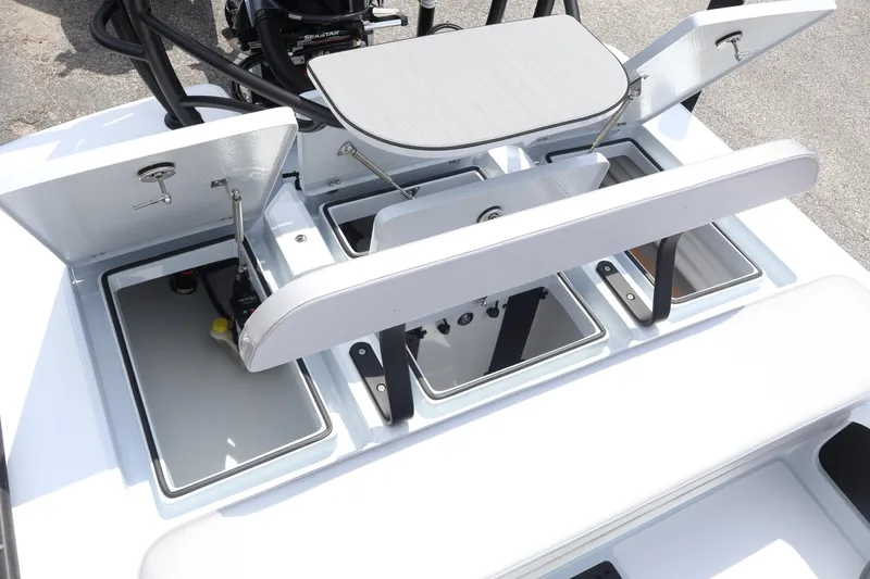 Slide: The Image of 2026 Chittum Skiffs Islamorada 21 boat with Yamaha outboard motor in a marina. - 24