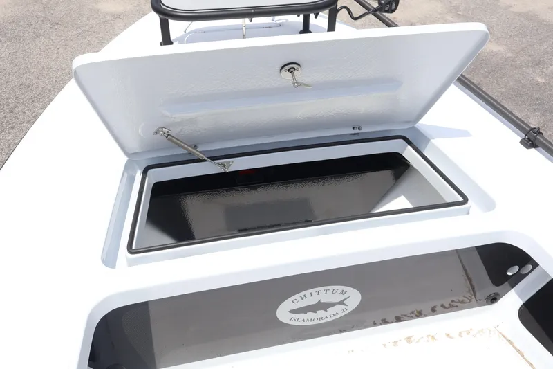 Slide: The Image of 2026 Chittum Skiffs Islamorada 21 boat storage compartments and seating area. - 25
