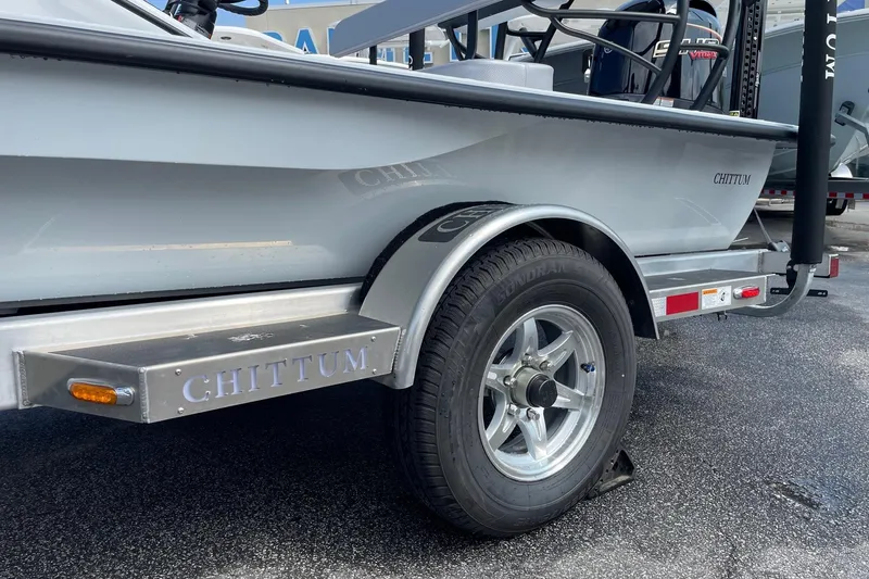 Slide: The Image of 2026 Chittum Skiffs Islamorada 21 boat storage compartment open, showcasing interior design. - 26