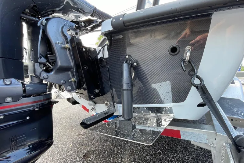 Slide: The Image of 2026 Chittum Skiffs Islamorada 21 boat trailer, showcasing wheel and branding details. - 27