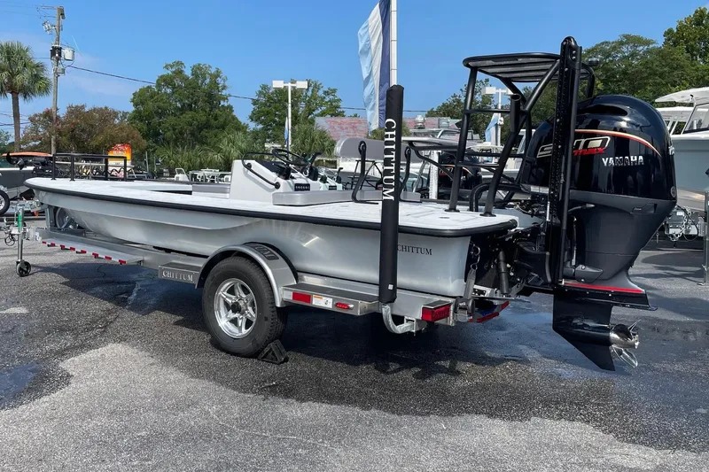 Slide: The Image of 2026 Chittum Skiffs Islamorada 21 boat on trailer, displayed outdoors. - 4