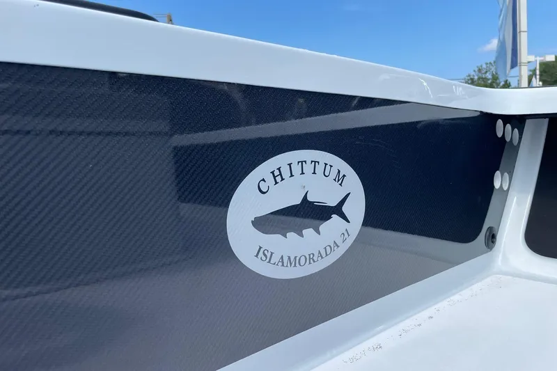 Slide: The Image of Chittum Skiffs Islamorada 21, 2026 model, logo on boat hull. - 44
