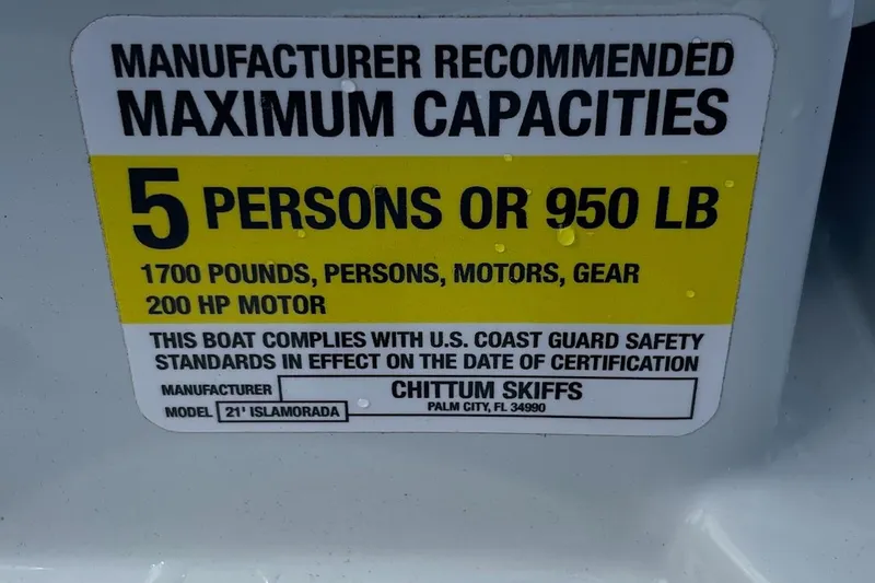 Slide: The Image of 2026 Chittum Skiffs Islamorada 21 boat logo on sleek carbon fiber finish. - 45