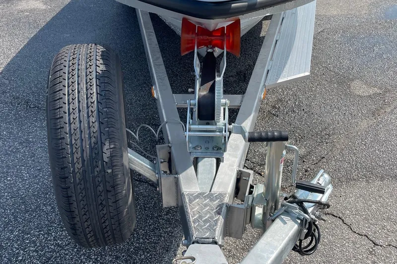 Slide: The Image of Trailer hitch and wheel of 2026 Chittum Skiffs Islamorada 21 boat on asphalt. - 54