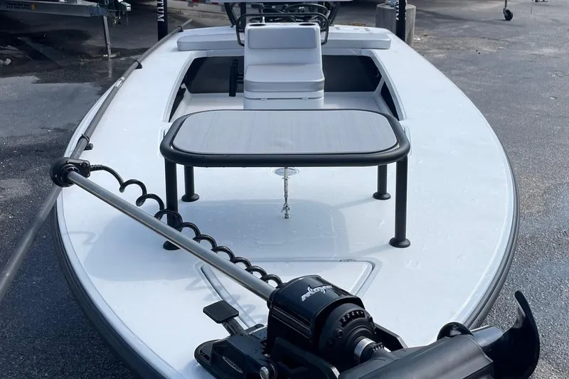 Slide: The Image of 2026 Chittum Skiffs Islamorada 21 boat interior with steering wheel and control panel. - 9